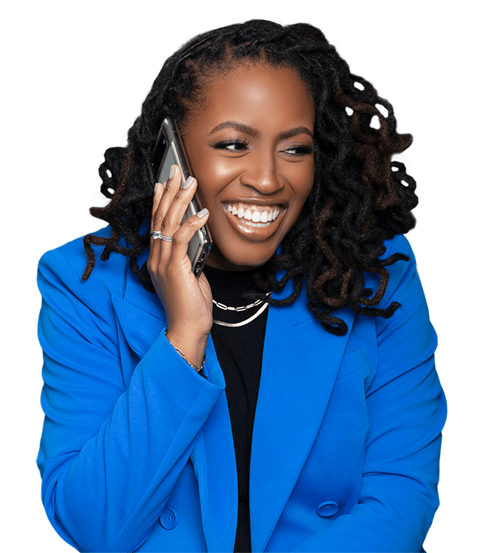 A woman in blue jacket talking on phone.