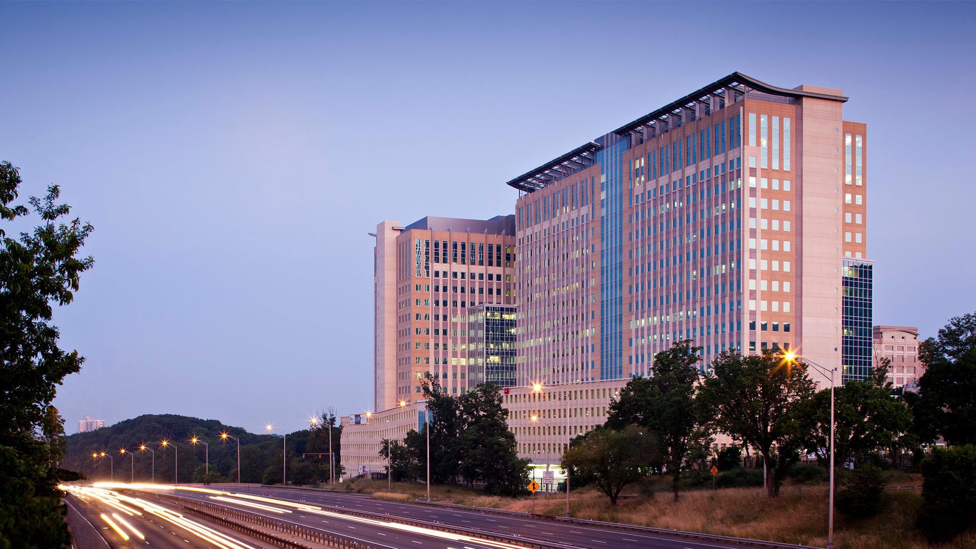 A large building with many windows and lights on it